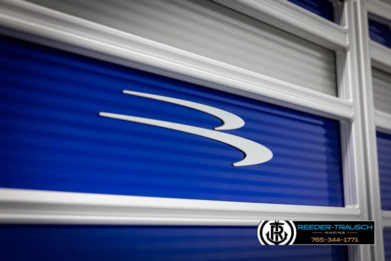 Slide: The Image of 2025 Bennington 21 SSRSE boat with blue exterior and logo detail. - 39