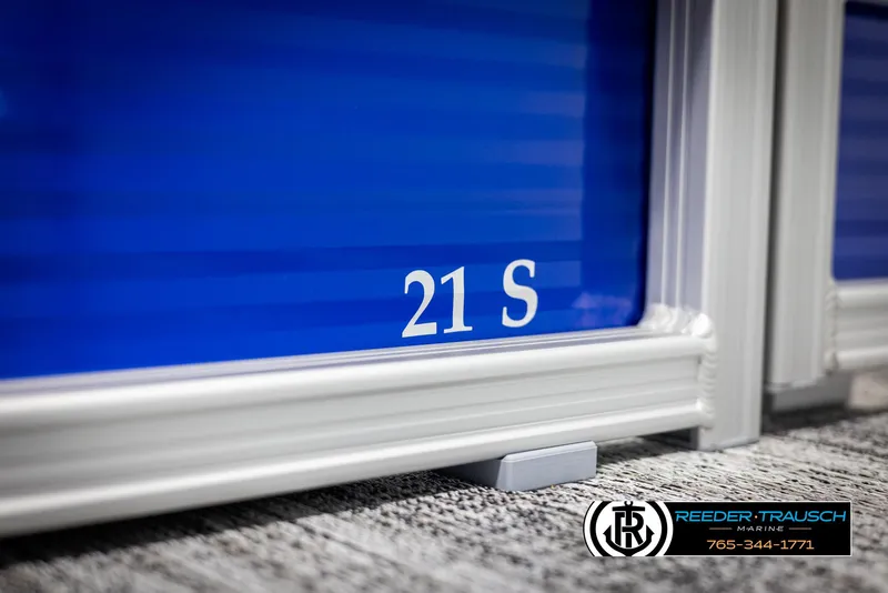 Slide: The Image of 2025 Bennington 21 SSRSE boat detail with blue panel and model number. - 40