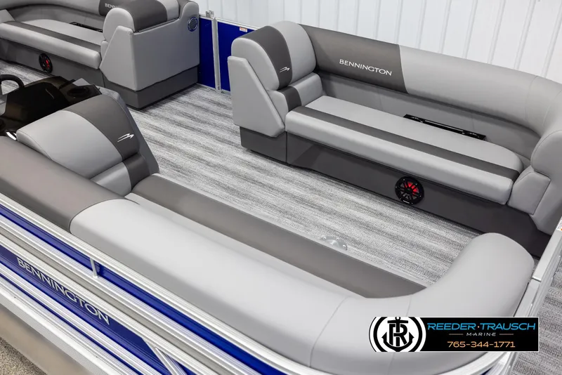 Slide: The Image of 2025 Bennington 21 SSRSE pontoon boat interior with gray seating and blue accents. - 8