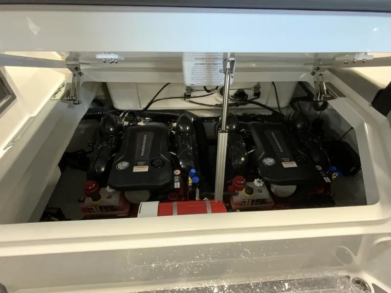 Slide: The Image of Engine compartment of a 2025 Cobalt R35 boat, featuring dual inboard engines. - 14