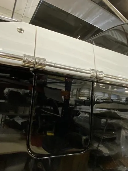 Slide: The Image of Close-up of a 2025 Cobalt R35 boat's sleek exterior detailing. - 5