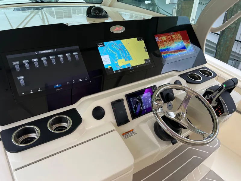 Slide: The Image of 2025 Scout 377 LXF boat dashboard with advanced navigation and control systems. - 17