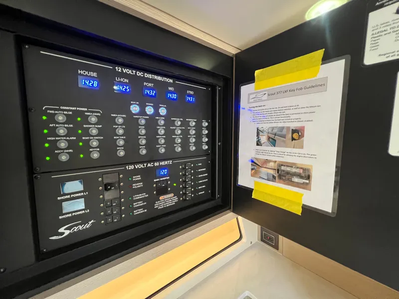 Slide: The Image of Control panel of 2025 Scout 377 LXF boat with key fob guidelines. - 25