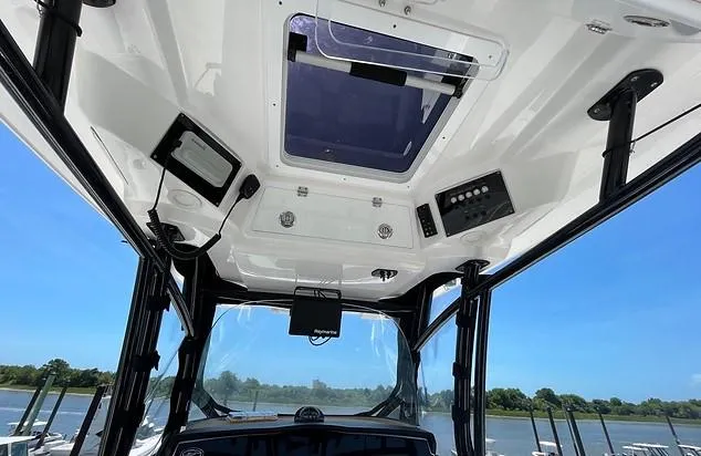Slide: The Image of Interior view of 2021 Sea Fox 328 Commander boat with control panel. - 20