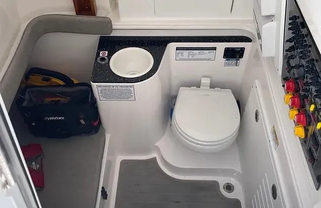 Slide: The Image of 2021 Sea Fox 328 Commander boat interior with toilet and control panel. - 21