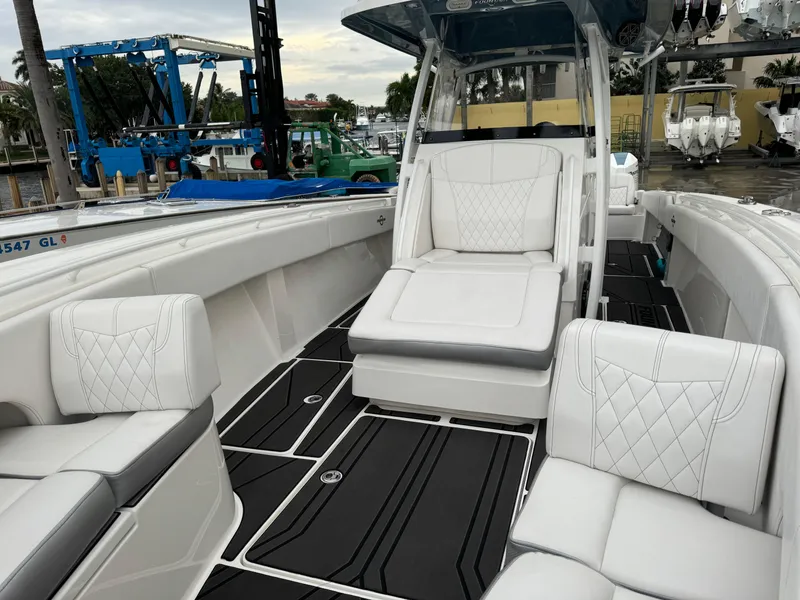 Slide: The Image of 2019 Fountain 38 CC boat with luxurious white seating and sleek design. - 12