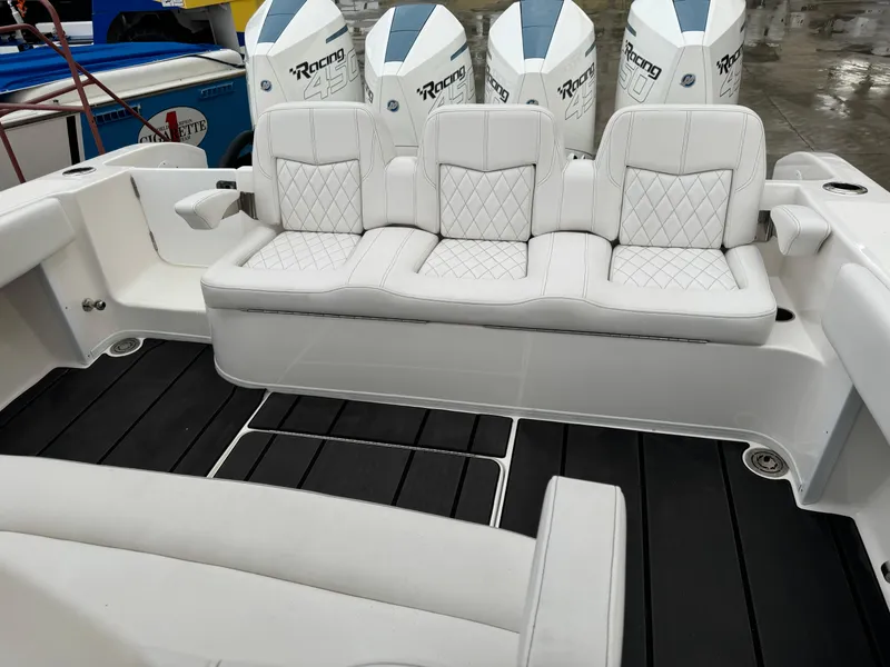 Slide: The Image of 2019 Fountain 38 CC boat with white seating and powerful engines. - 19
