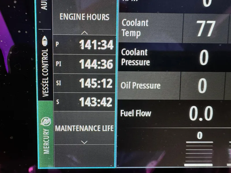Slide: The Image of Boat engine display showing hours, coolant temperature, and pressures for 2019 Fountain 38 CC. - 21