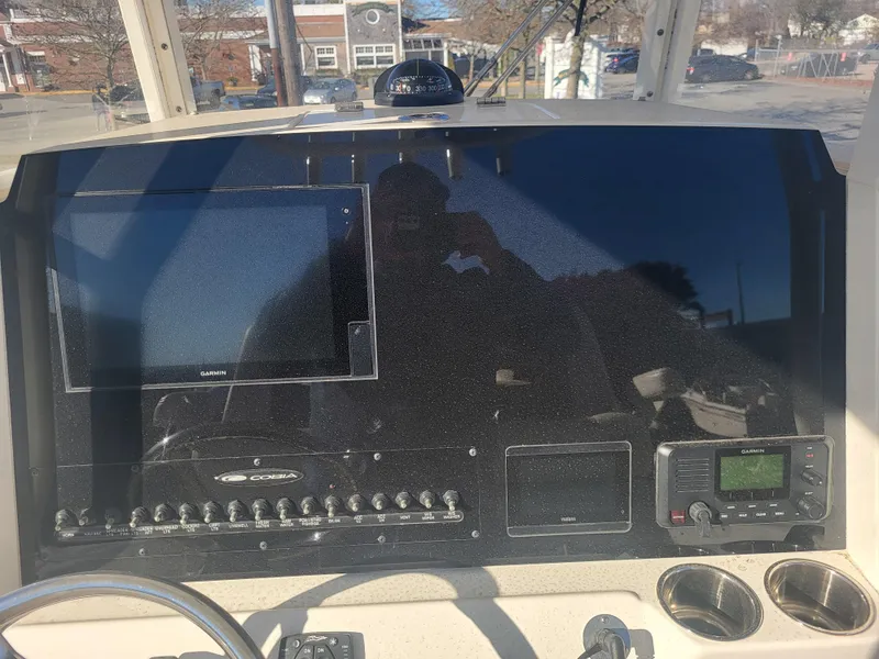 Slide: The Image of Cobia 280 Center Console 2021 dashboard with navigation and control panels. - 16