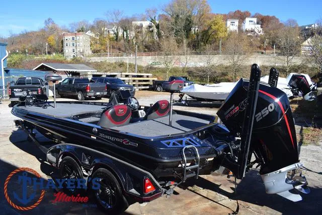 Slide: The Image of 2021 Ranger Z520L bass boat with powerful 250 HP engine, parked outdoors. - 10