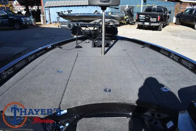 Slide: The Image of 2021 Ranger Z520L boat deck with Thayer's Marine logo, featuring spacious carpeted area. - 14