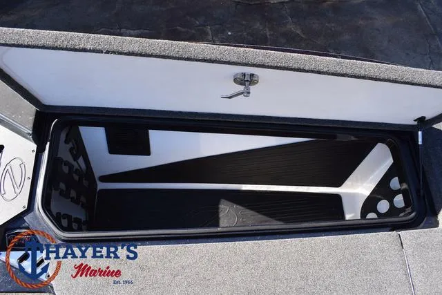 Slide: The Image of Open storage compartment in a 2021 Ranger Z520L boat by Thayer's Marine. - 15