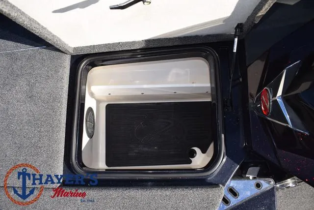Slide: The Image of 2021 Ranger Z520L boat storage compartment at Thayer's Marine. - 17