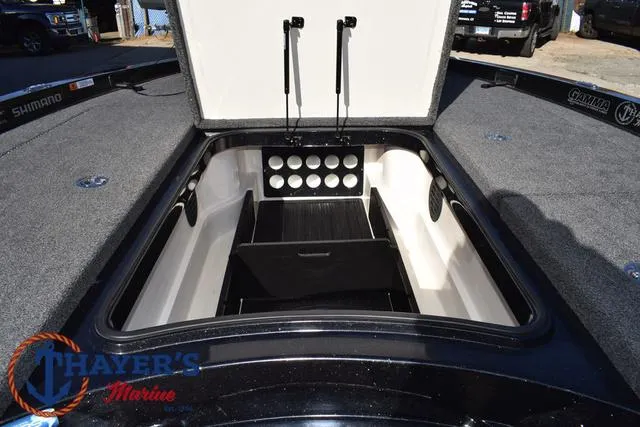 Slide: The Image of 2021 Ranger Z520L boat storage compartment with open lid, showcasing organized interior space. - 18