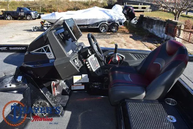 Slide: The Image of 2021 Ranger Z520L boat cockpit with steering wheel and control panel. - 29