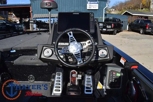 Slide: The Image of 2021 Ranger Z520L boat dashboard with steering wheel and electronic controls. - 30
