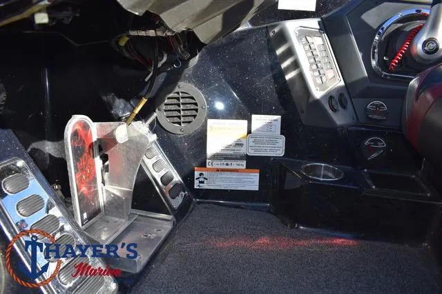 Slide: The Image of 2021 Ranger Z520L boat cockpit with control panel and foot pedals. - 32