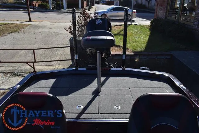 Slide: The Image of 2021 Ranger Z520L boat at Thayer's Marine dealership, rear view with seating and motor. - 35