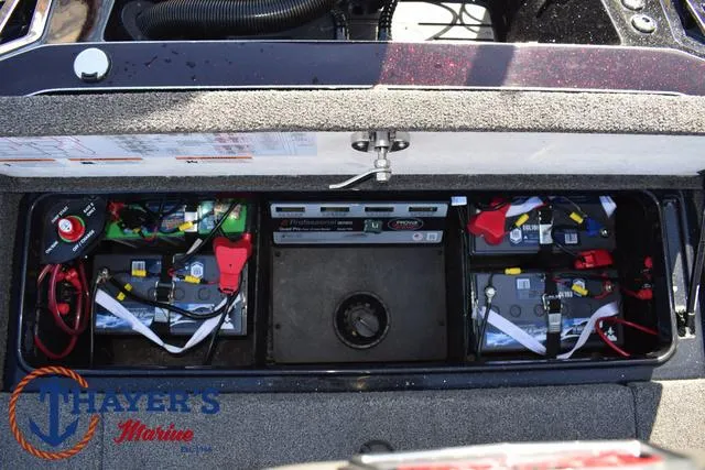 Slide: The Image of 2021 Ranger Z520L boat battery compartment with multiple batteries and wiring. - 39