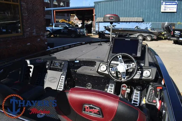 Slide: The Image of 2021 Ranger Z520L boat interior with advanced navigation system and steering wheel. - 41