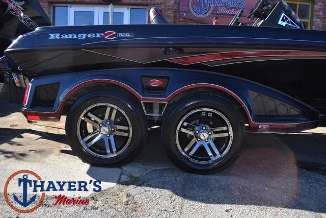 Slide: The Image of 2021 Ranger Z520L boat with dual axle trailer at Thayer's Marine. - 5