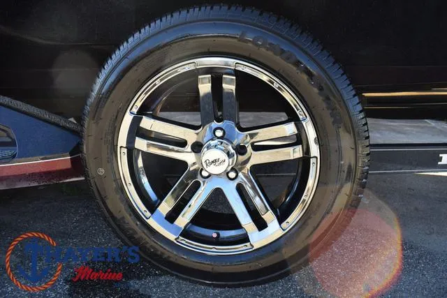 Slide: The Image of 2021 Ranger Z520L chrome wheel with tire, featuring Ranger's Marine logo. - 6