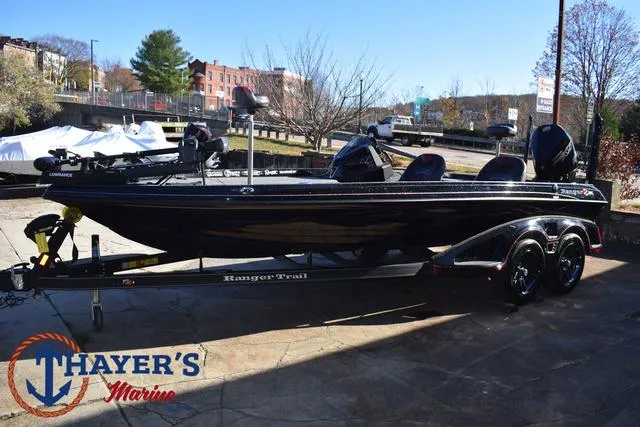 Slide: The Image of 2021 Ranger Z520L boat on trailer at Thayer's Marine dealership. - 9
