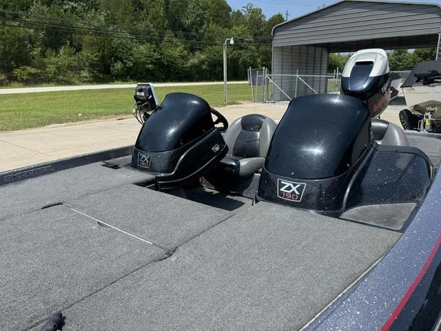 Slide: The Image of 2011 Skeeter ZX 190 boat with dual seats and motor, parked outdoors. - 10