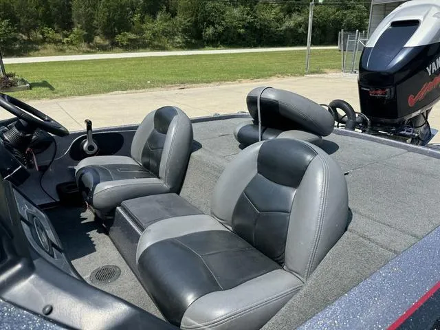 Slide: The Image of 2011 Skeeter ZX 190 boat interior with black and gray seating, Yamaha motor in background. - 11