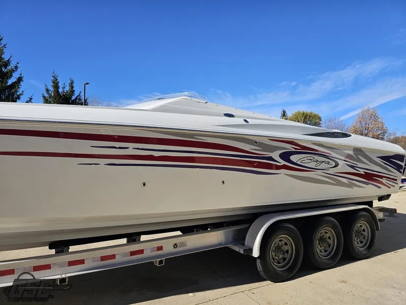 Slide: The Image of 2004 Baja 33 Outlaw speedboat on a trailer, featuring sleek red and black graphics. - 17