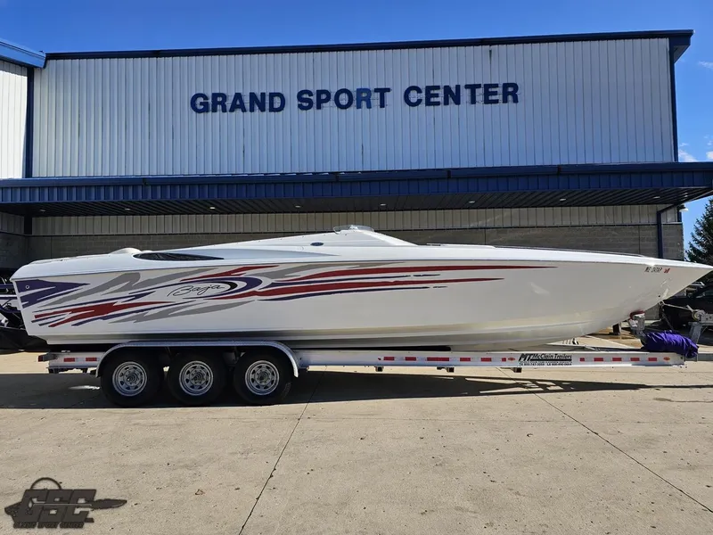 Slide: The Image of 2004 Baja 33 Outlaw boat on trailer at Grand Sport Center. - 2