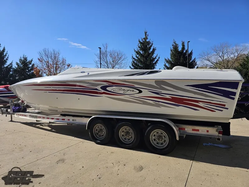 Slide: The Image of 2004 Baja 33 Outlaw speedboat on a trailer, featuring sleek red and blue graphics. - 23