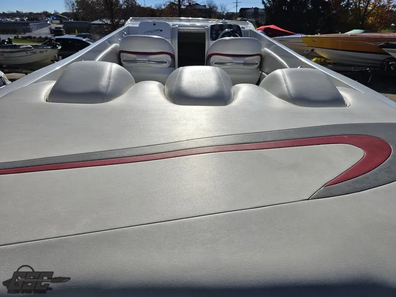 Slide: The Image of 2004 Baja 33 Outlaw boat interior with sleek white and red upholstery. - 36