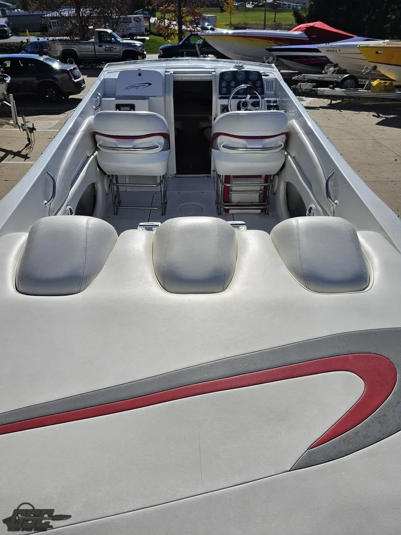 Slide: The Image of 2004 Baja 33 Outlaw boat interior with white and red seating. - 37