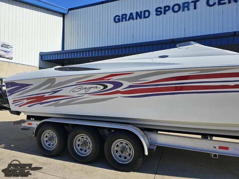 Slide: The Image of 2004 Baja 33 Outlaw boat on trailer at Grand Sport Center. - 6