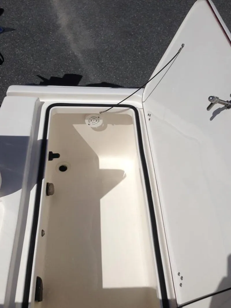 Slide: The Image of Open storage compartment on a 2005 Young Boats Young 20. - 13