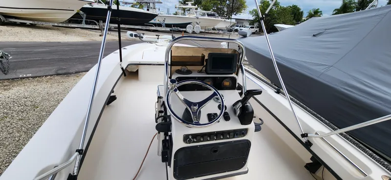 Slide: The Image of 2005 Young Boats Young 20 center console with steering wheel and navigation equipment. - 19