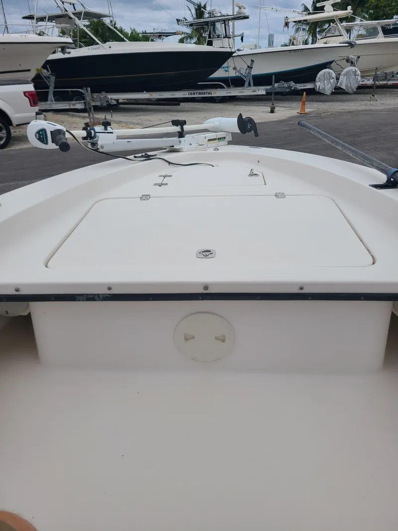 Slide: The Image of 2005 Young Boats Young 20 deck view with trolling motor in marina. - 8