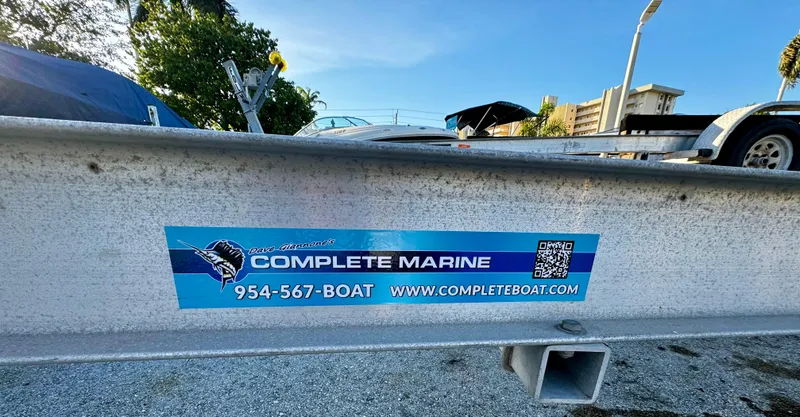 Slide: The Image of 2016 REAL X Model R32X trailer with Complete Marine contact details and website. - 11