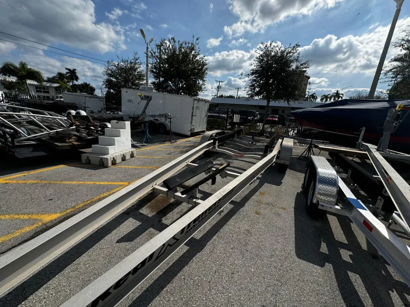 Slide: The Image of 2016 REAL X Model R32X trailer in parking lot under cloudy sky. - 19