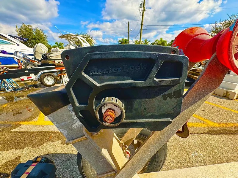 Slide: The Image of Master Lock on 2016 REAL X Model R32X trailer in sunny outdoor setting. - 20