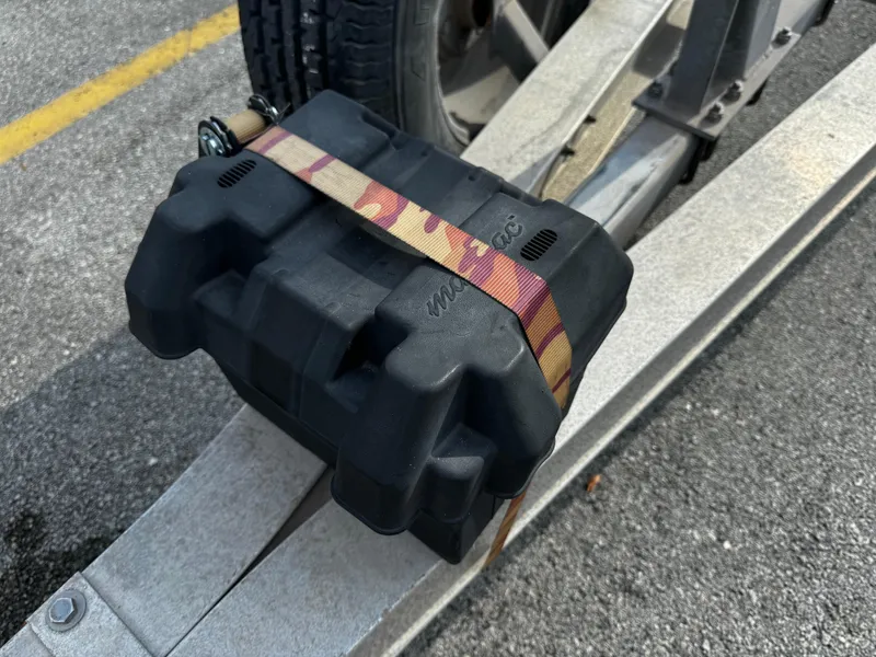 Slide: The Image of Black box secured on 2016 REAL X Model R32X trailer with camo strap. - 24