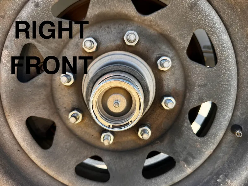Slide: The Image of Close-up of 2016 REAL X Model R32X trailer wheel hub labeled "Right Front". - 36
