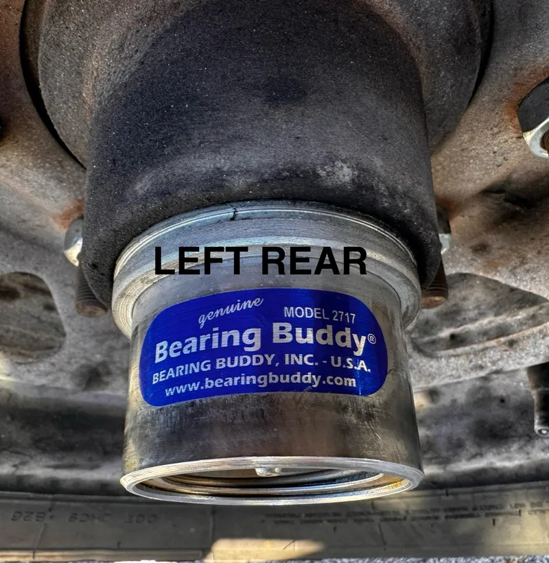 Slide: The Image of Bearing Buddy Model 2717 on 2016 REAL X Model R32X trailer, left rear view. - 38