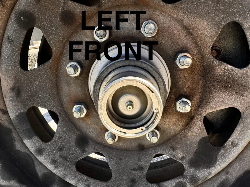 Slide: The Image of Close-up of 2016 REAL X Model R32X trailer left front wheel hub. - 39