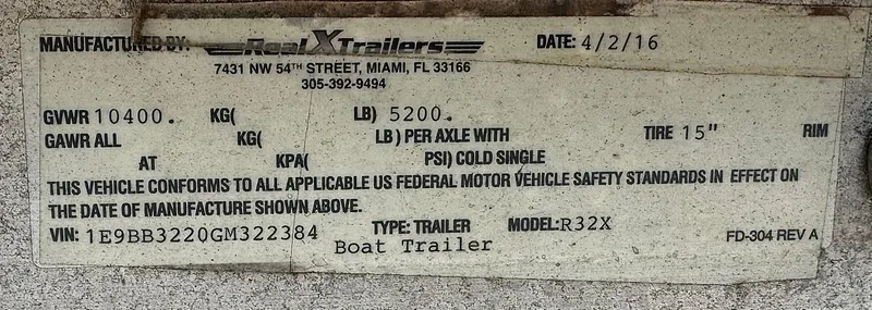 Slide: The Image of 2016 REAL X Model R32X boat trailer label with specifications and VIN details. - 41
