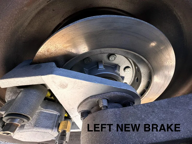 Slide: The Image of Close-up of a 2016 REAL X Model R32X trailer's new left brake system. - 44