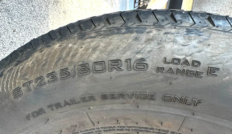 Slide: The Image of Trailer tire with specifications: ST235/80R16, Load Range E, for trailer service only. - 9