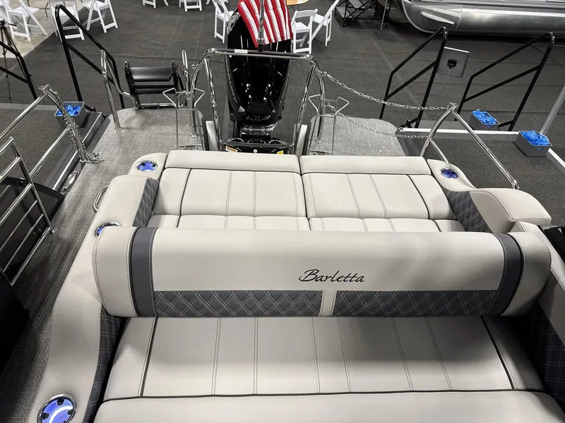 Slide: The Image of 2025 Barletta Lusso L25-UCA luxury boat interior with plush seating and elegant design. - 13