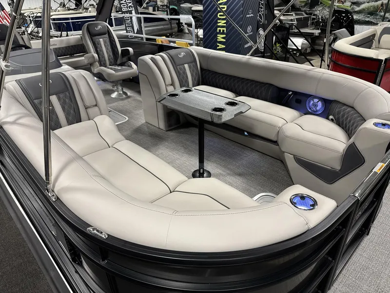 Slide: The Image of Luxurious 2025 Barletta Lusso L25-UCA pontoon boat interior with plush seating and table. - 15